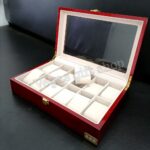 Showcase and protect your watch collection with the Wooden Watch Organizer 12-Slot, a premium storage box designed for style, organization, and long-lasting protection. Crafted from high-quality wood with a smooth polished finish, this organizer adds a touch of sophistication to any bedroom, office, or dressing area while keeping your watches neatly arranged. Featuring 12 spacious compartments, this watch organizer provides ample room to store multiple watches in one secure location. Each slot includes a soft cushioned pillow that helps maintain the shape of your watches while protecting them from scratches, dust, and damage. The transparent viewing lid allows you to admire your collection at a glance while keeping it safely enclosed. Its elegant wooden construction and refined craftsmanship make it suitable for both personal collections and retail displays. Whether you own luxury watches, fashion watches, or a mix of both, this organizer helps preserve their condition while enhancing their presentation. Perfect for watch enthusiasts, collectors, and gift buyers, the 12-slot wooden watch box is an excellent choice for birthdays, anniversaries, Father's Day, graduations, and other special occasions.