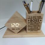 Personalized Wooden LED Clock Pen Holder Personalized Wooden LED Clock Pen Holder with custom engraving. A stylish bamboo desk organizer featuring a digital clock and pen holder for office gifts.